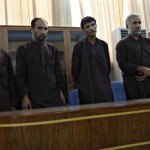 Five of seven men convicted of raping and robbing appear at a court in Kabul