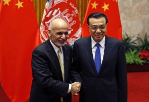 Li and Ghani pose for pictures at the Great Hall of the People in Beijing
