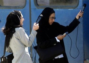 Afghan women reporters set up their sound recorders in a media facility in Kabul on March 16, 2003. ..