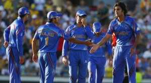 Afghanistan's bowler Zadran is congratulated, after Australian batsman Smith was dismissed for 95 runs, during their Cricket World Cup match in Perth