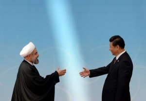 Iran's President Rouhani shakes hands with his Chinese counterpart Xi before the opening ceremony of the CICA summit in Shanghai