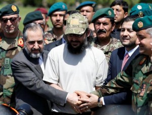 Ali Haider Gilani shakes hands after he was rescued in Afghanistan in a joint operation by Afghan and U.S. forces, at the Defence ministry in Kabul