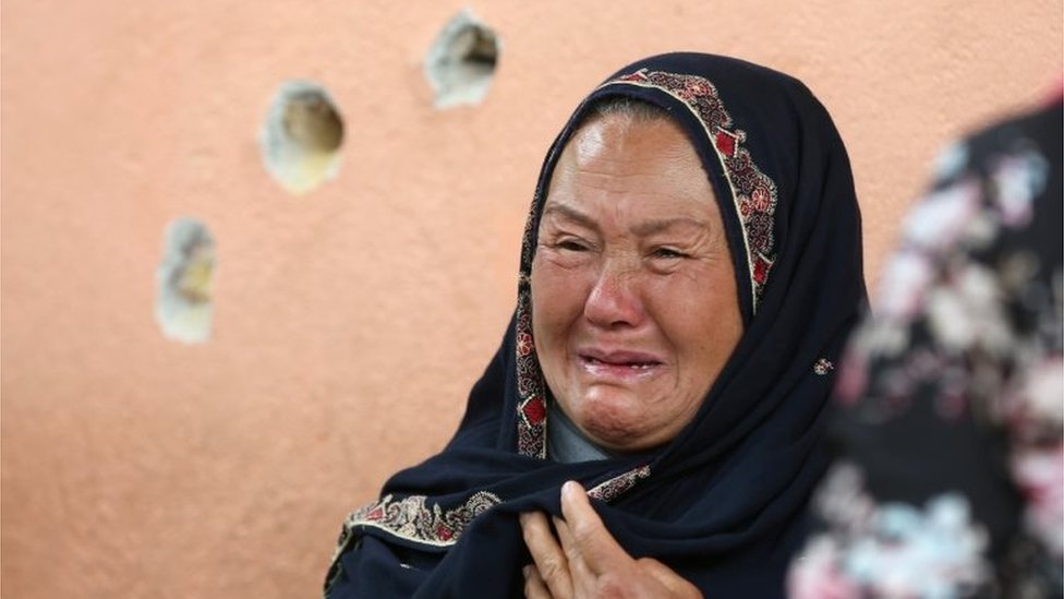 An Afghan woman cries while looking for her relative at a hospital which came under attack yesterday in Kabul, Afghanistan May 13, 2020.