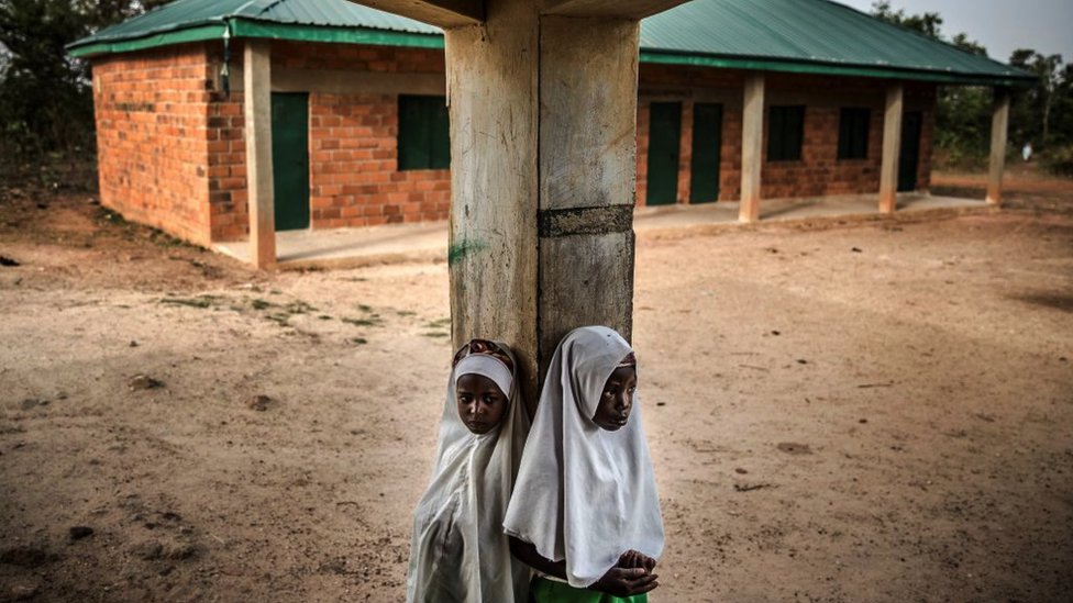 Two Fulani girls at an empty school playground
