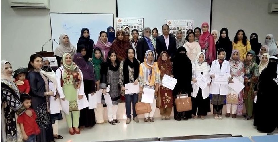 A group of female doctors who finished their refresher course