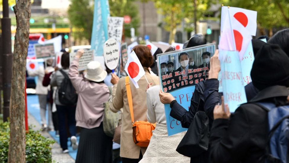 People take part in a march to protest against the marriage between Japan's Princess Mako and Kei Komuro in Tokyo on October 26, 2021.